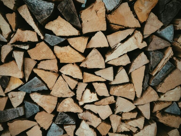 Neatly stacked split firewood ready for heating a log cabin through winter